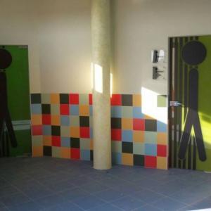 Rotulación fotomural en vinilo. Instalaciones deportivas Entrenúcleos Dos Hermanas Sevilla