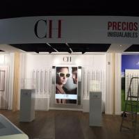 Rotulación fotomural Visual Óptica en Expo Local Bellavista Sevilla. Lacoste, Ray ban, Carolina Herrera, Bogue, Oakley, Tous, Carrera