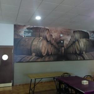 Rotulación de Foto mural en vinilo especial de pared laminado mate. El Rincón de María en Dos Hermanas Sevilla.
